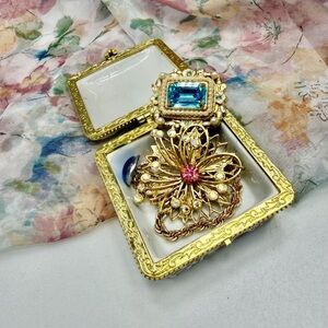 Vintage Coro Gold Brooches in a trinket box